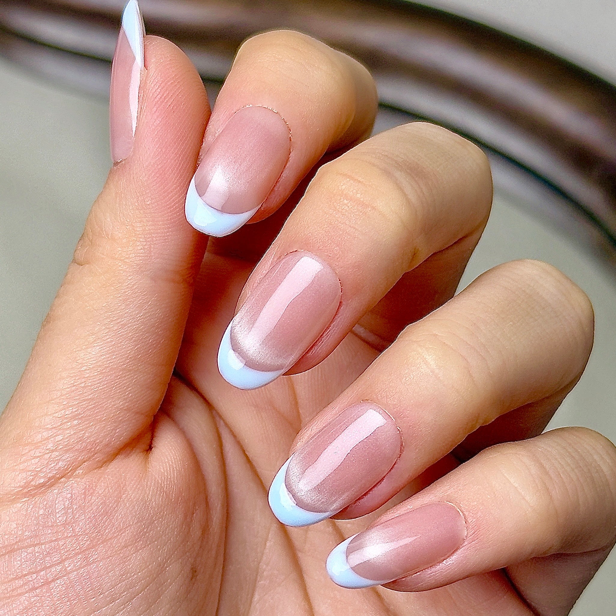 Demi-Lune press-on nails worn on hand