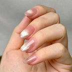 Doré press-on nails worn on hand