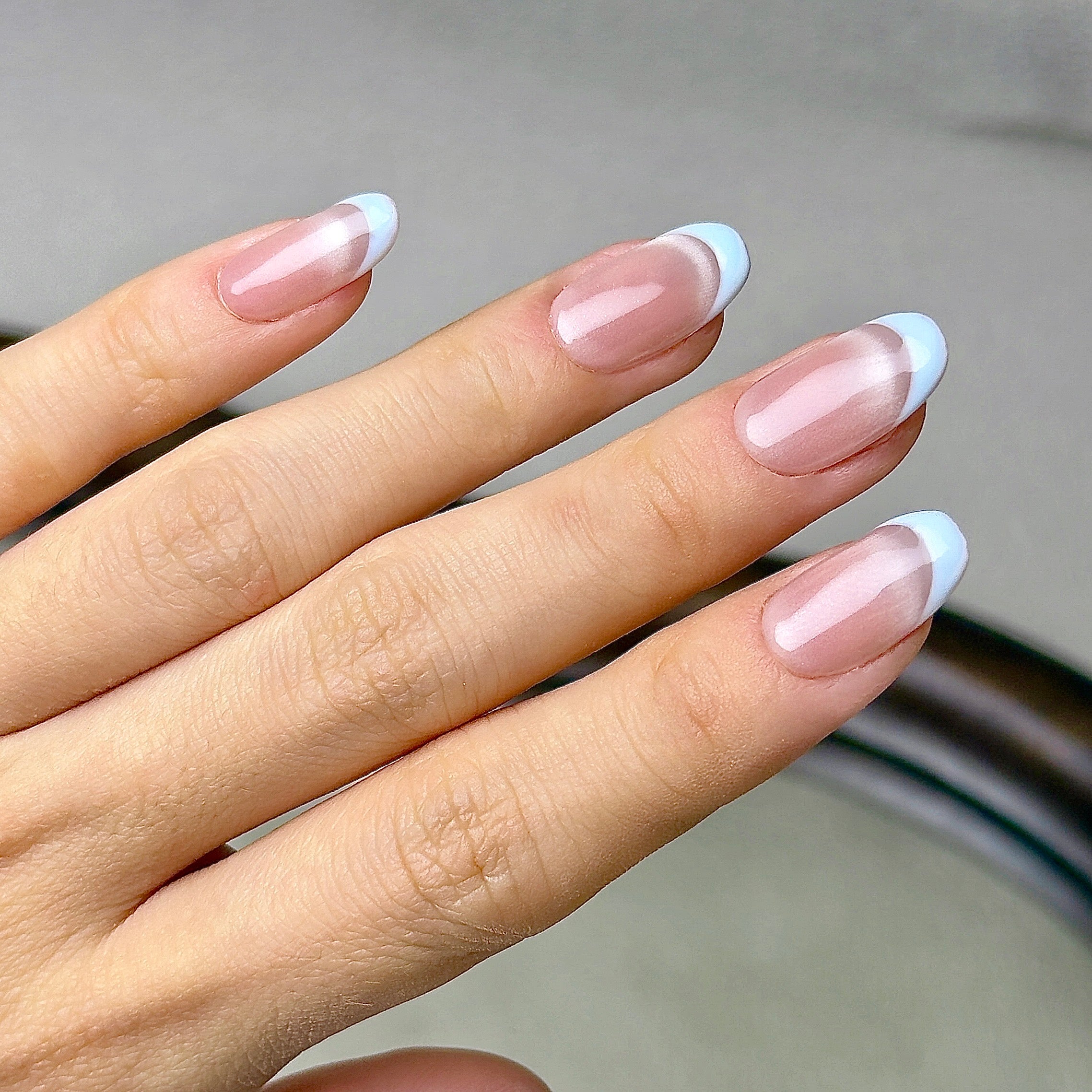 Demi-Lune press-on nails worn on hand