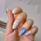 Marée press-on nails worn on hand — 3D shell and starfish detail