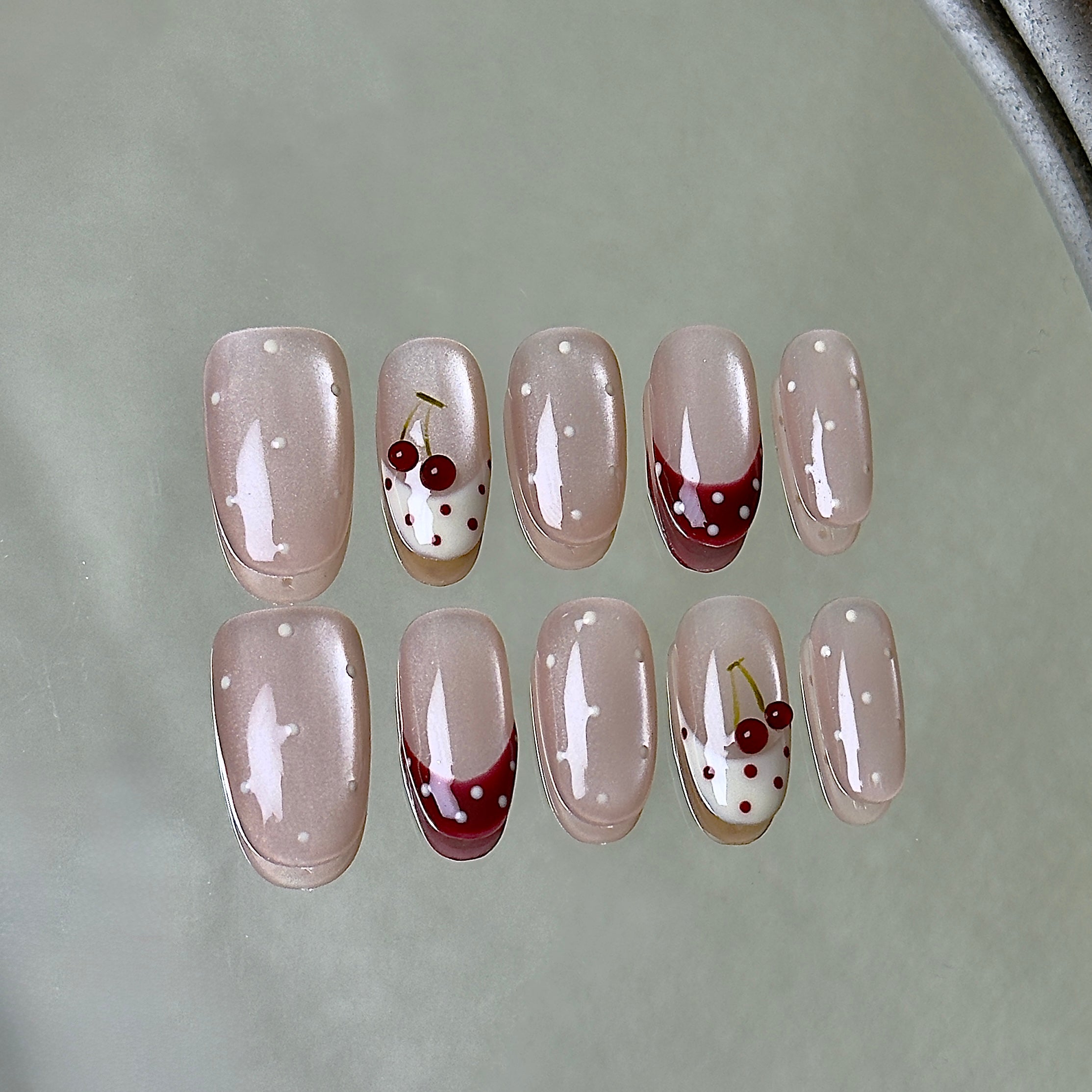 Griotte press-on nail set displayed flat