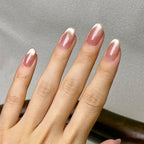 Doré press-on nails worn on hand