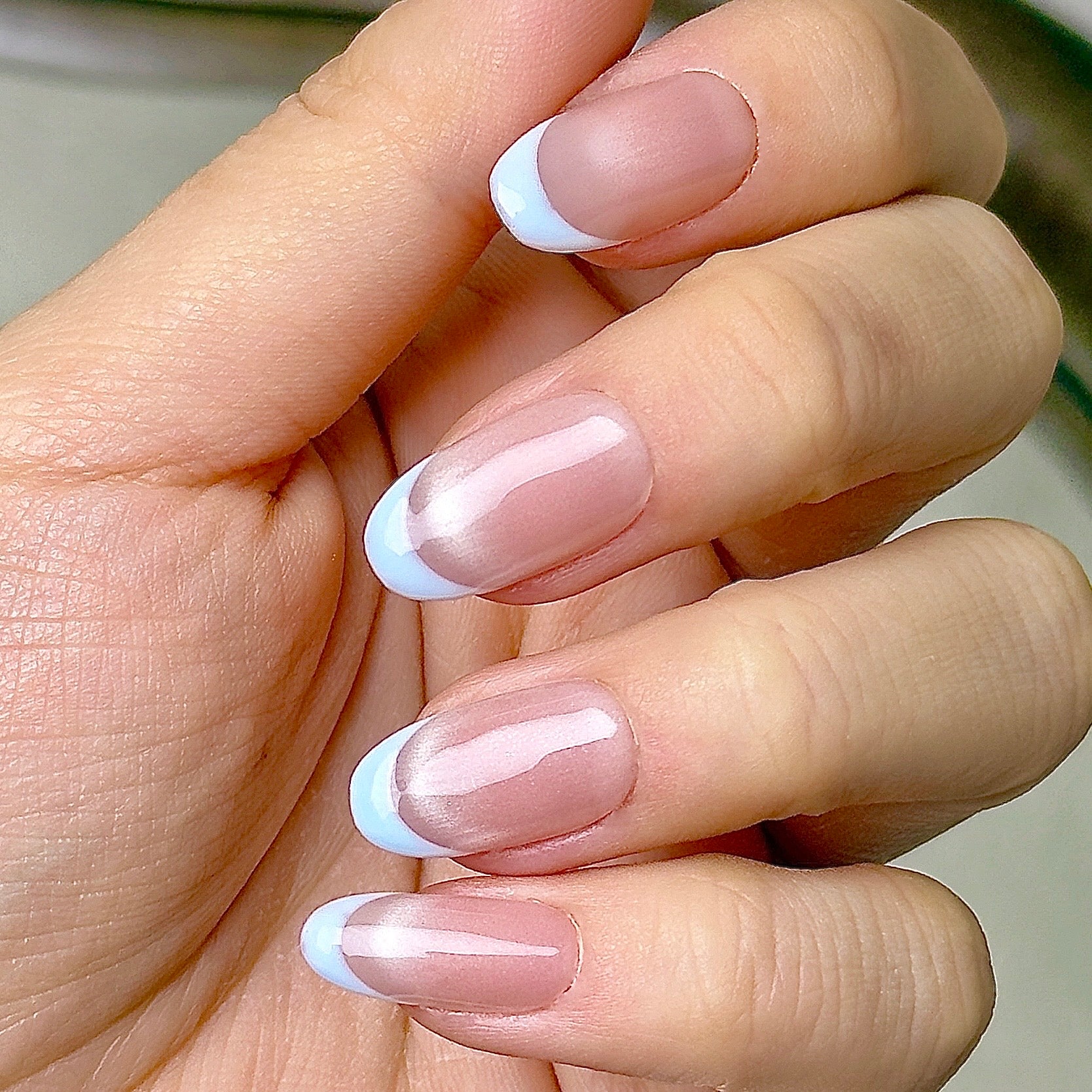 Demi-Lune press-on nails worn on hand