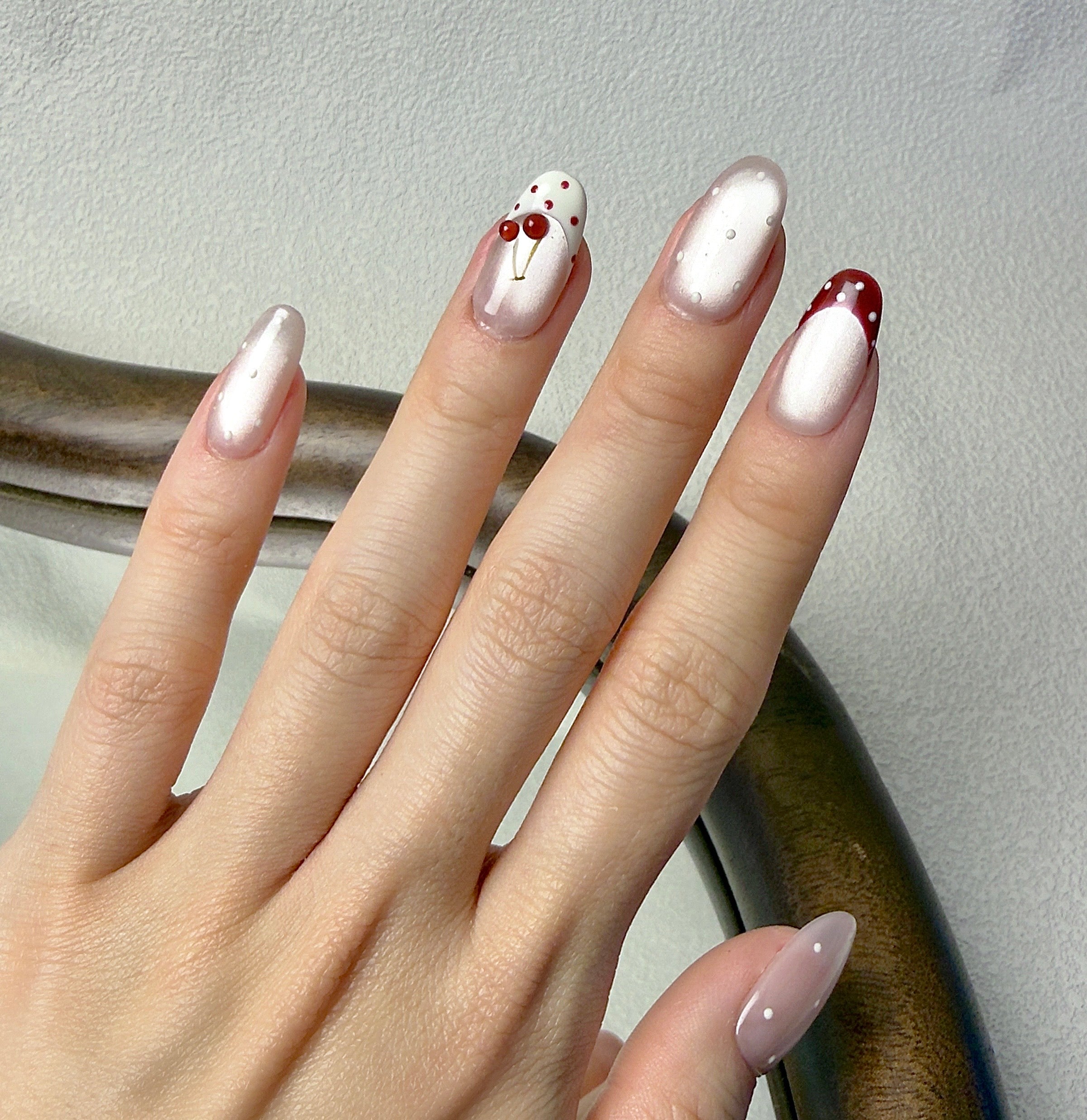 Griotte press-on nails worn on hand