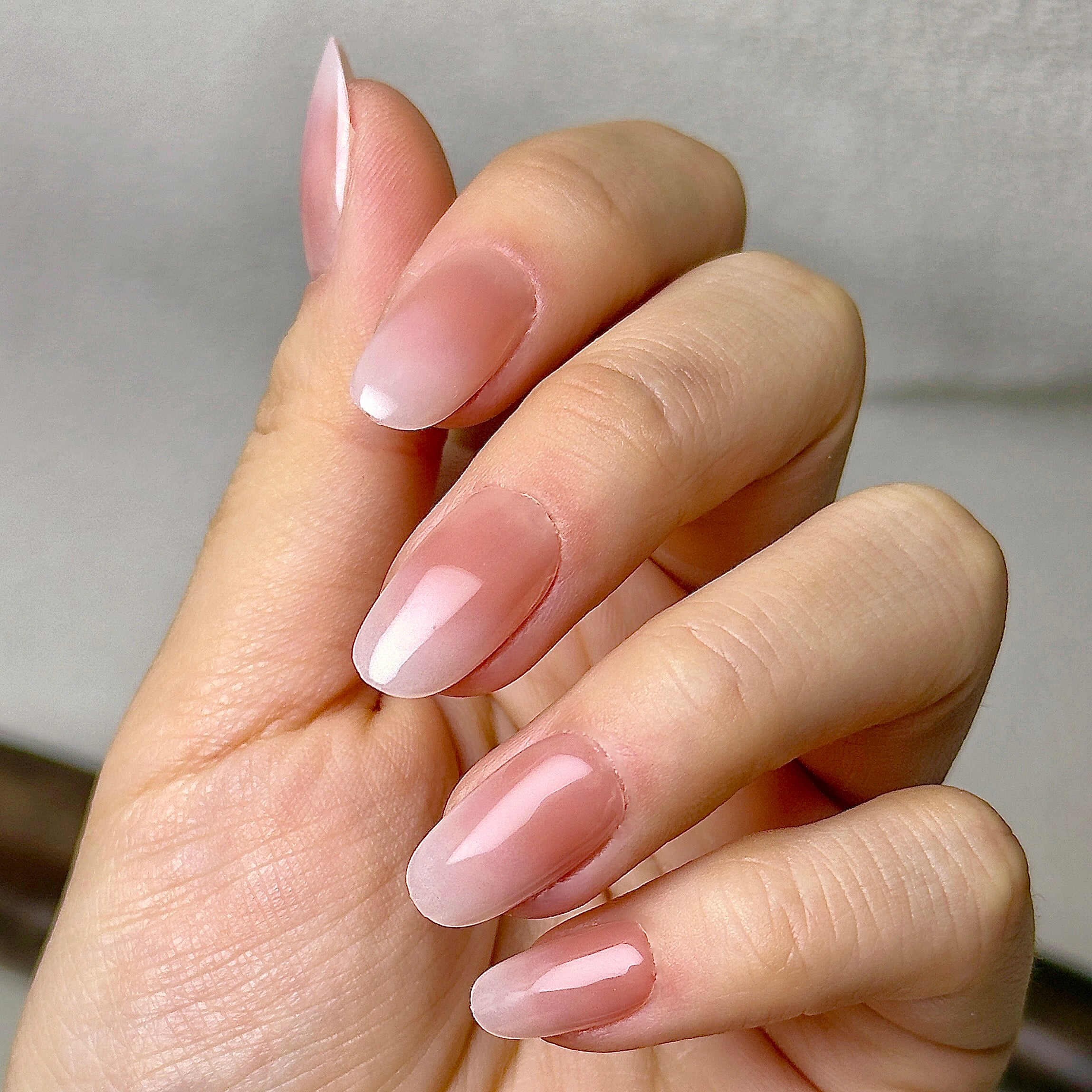 Nue press-on nails worn on hand
