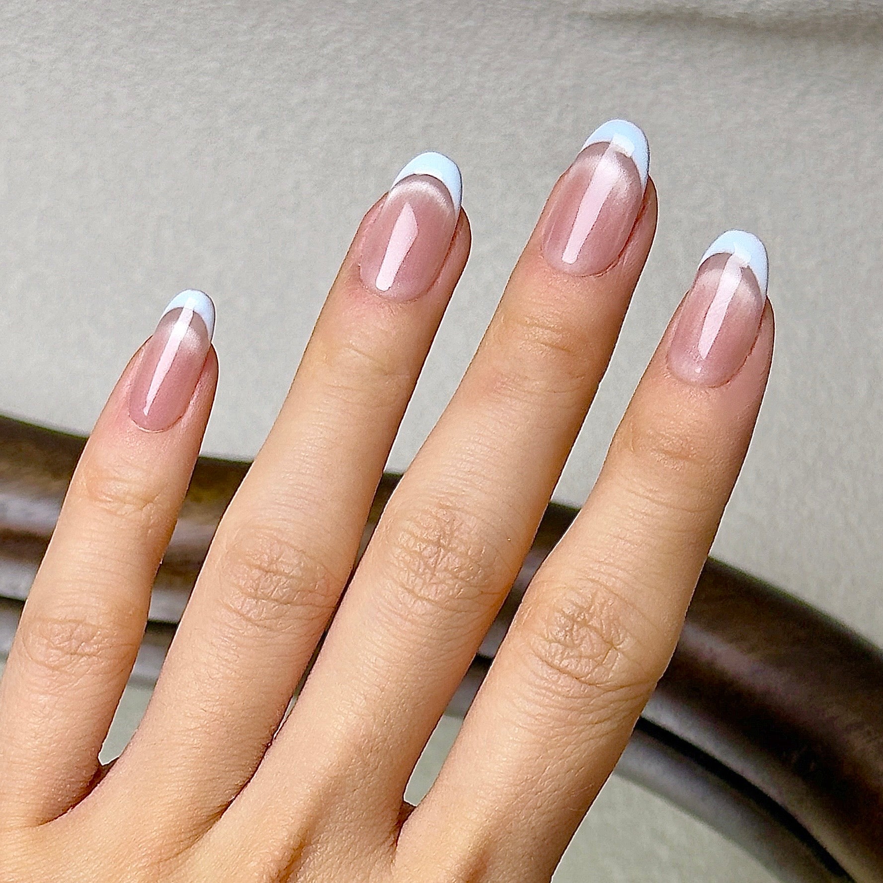 Demi-Lune press-on nails worn on hand